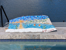 Load image into Gallery viewer, Mosaic artwork of the view from Le Fioriere Hotel Bar, Praiano, Amalfi Coast, Italy, displayed on a poolside ledge with water in the background 
